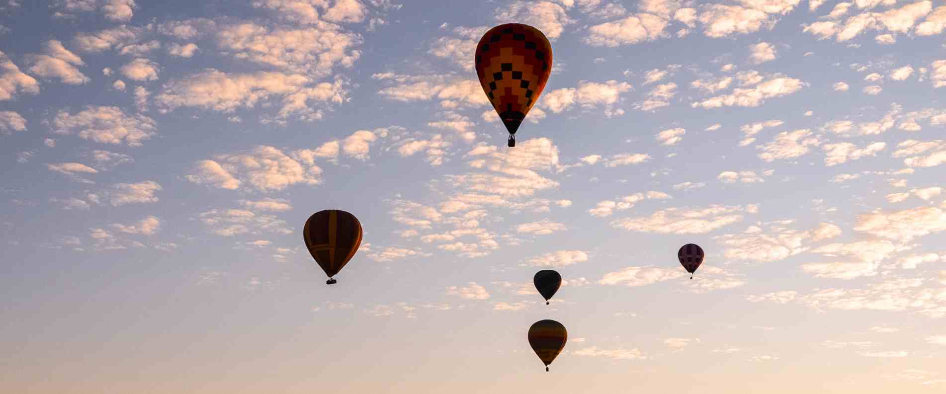 Hot air ballons in the sky at dusk